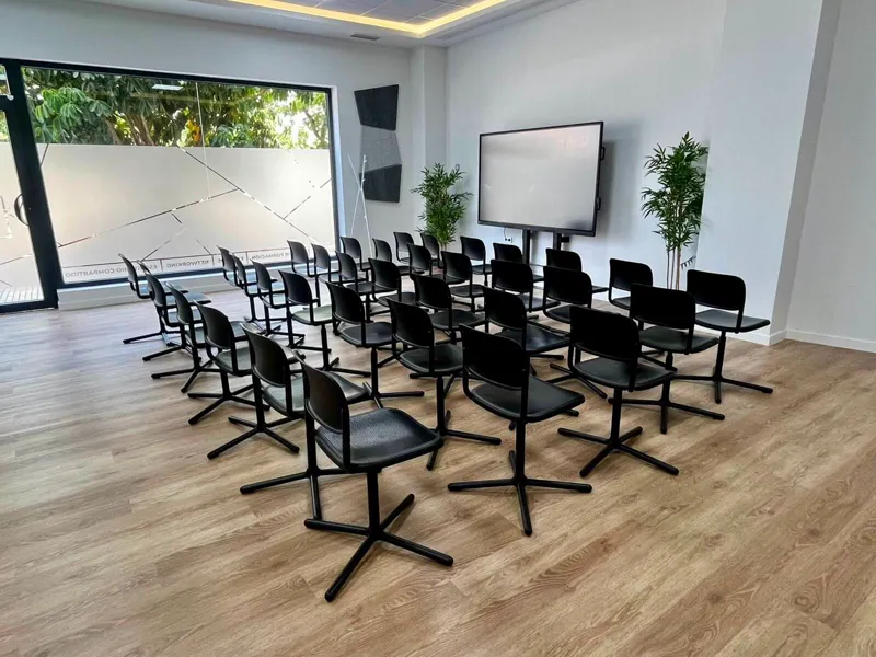 The Felgueroso Room with its street-facing glass frontage and digital whiteboard