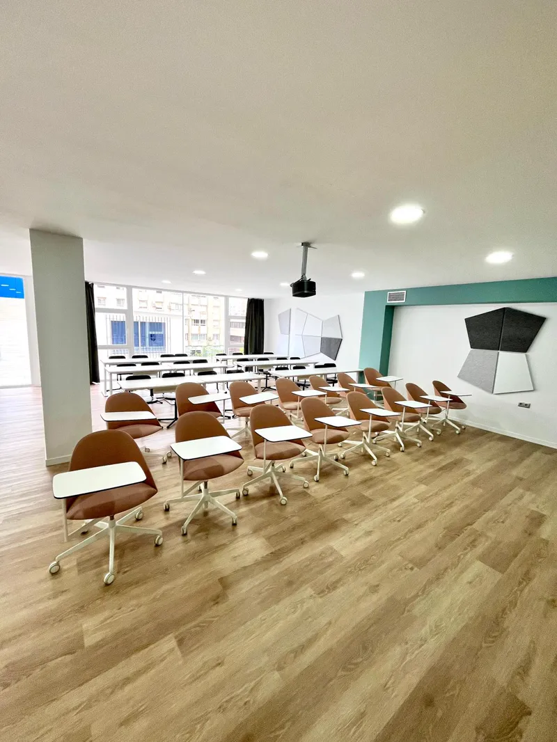 The Cayman Room with training chairs in rows and a projector