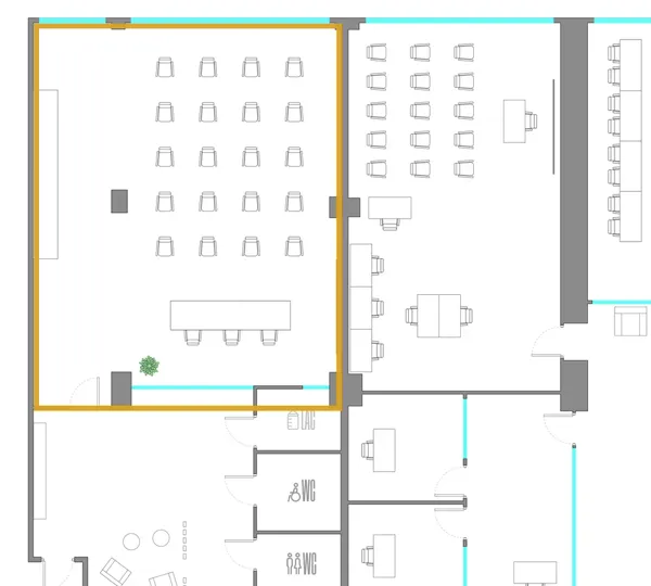 Floor plan of the Cayman Room, outlined in gold, with the windows at the top and the common areas and toilets below